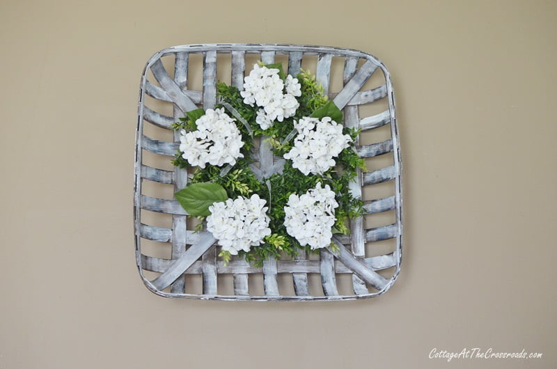 Farmhouse wreath in a tobacco basket