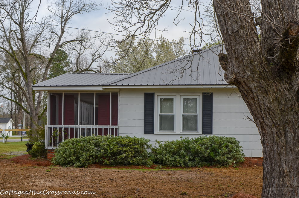 Side of house with new metal roof