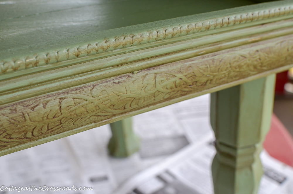 Umber paint used to highlight the crevices of a painted magazine rack