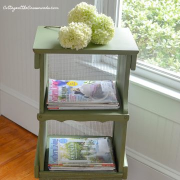 Green cottage style magazine rack