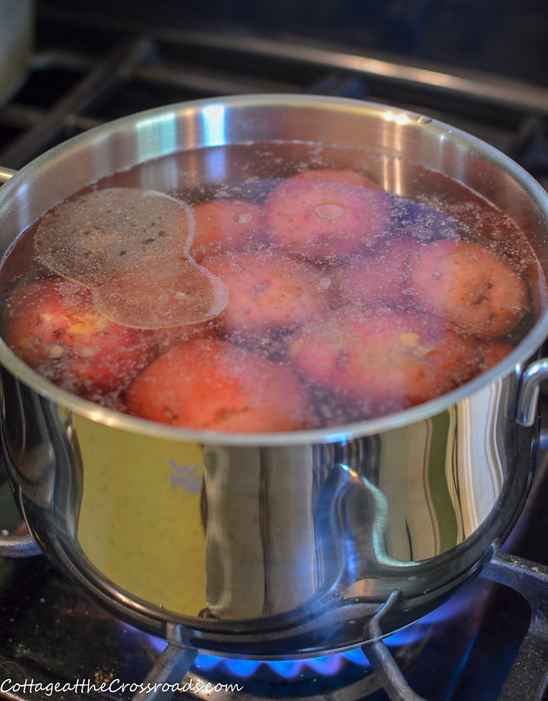 Red potatoes in a pot of water