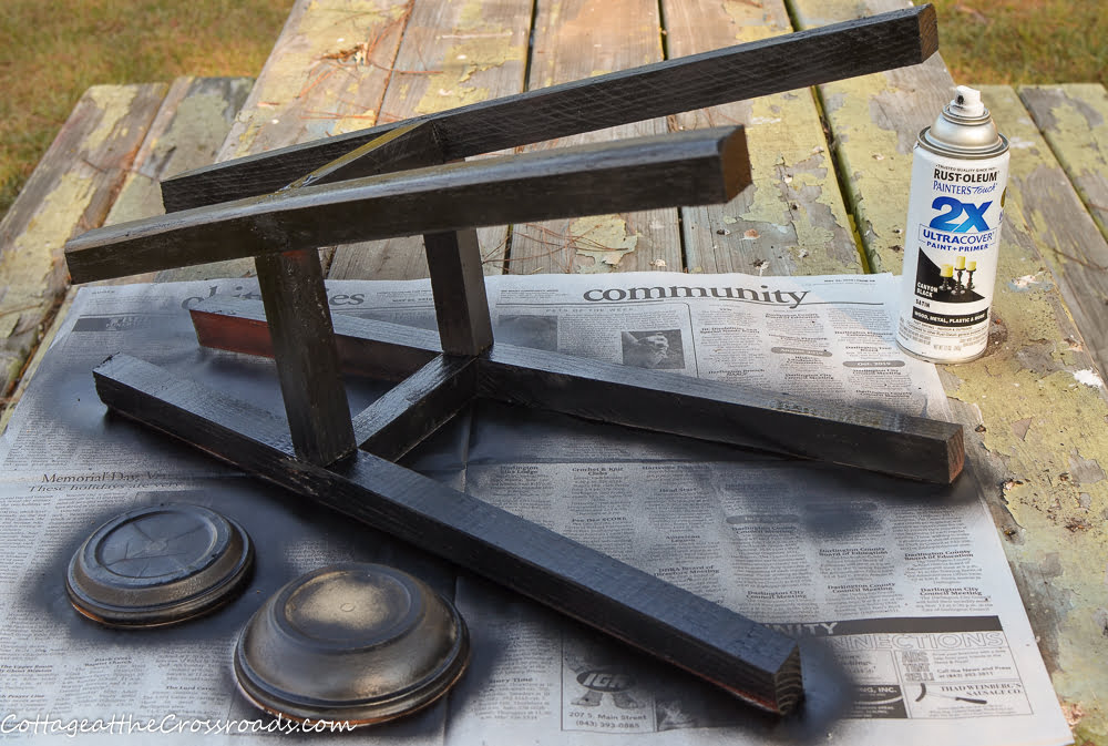Painted legs of a wooden stool
