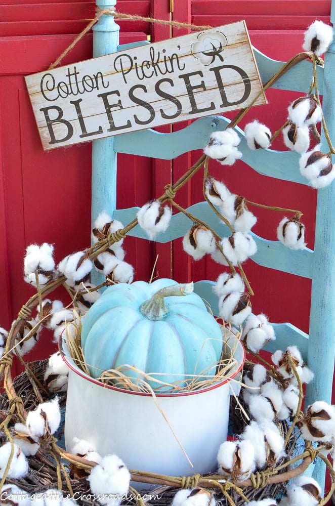 Old chair decorated with cotton and a cotton pickin' blessed sign