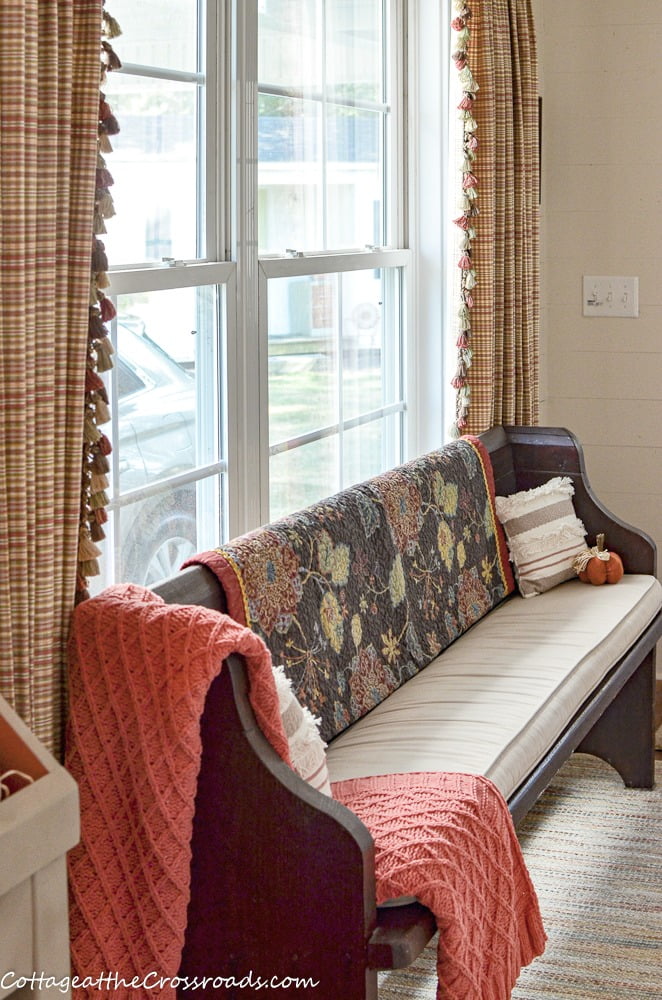 Church pew in mudroom/laundry