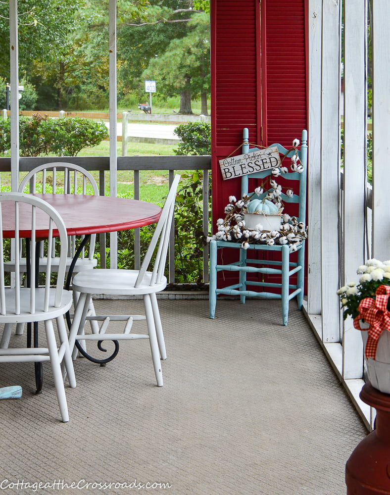 Old chair decorated with cotton with a cotton pickin' blessed sign