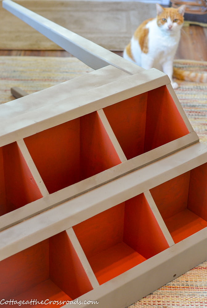 Painting the inside of the storage bins on a cubby