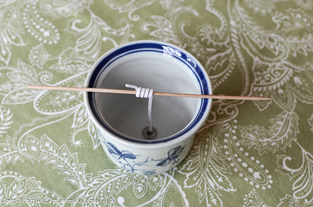 Blue and white pot used in making a homemade candle