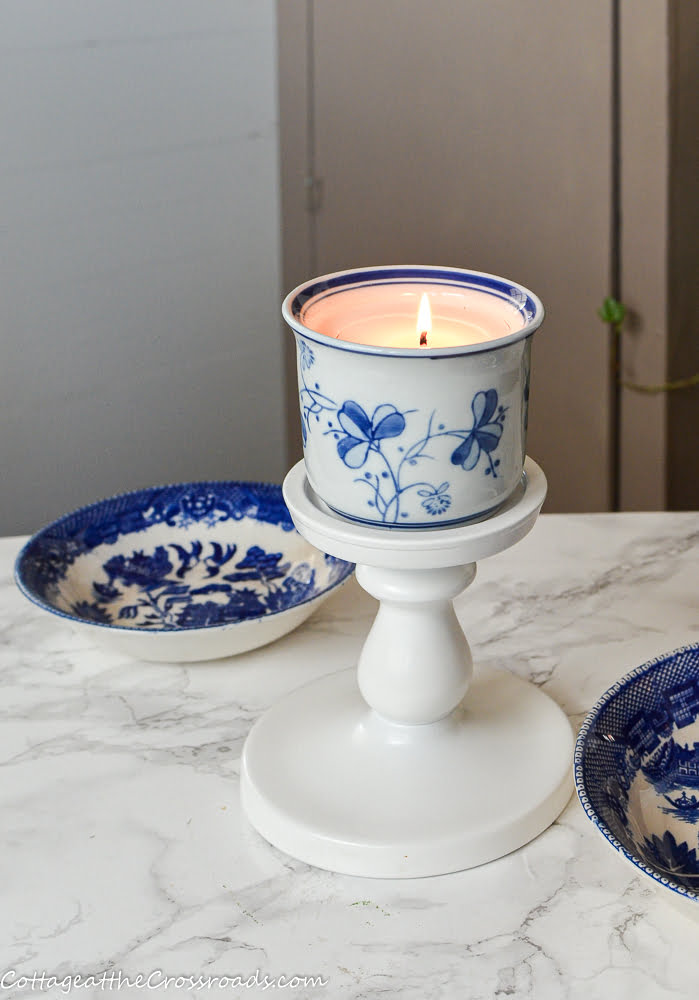 Homemade candle in a blue and white pot