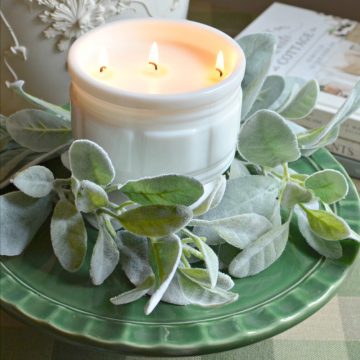 thrifty homemade candle in a vintage milkglass container