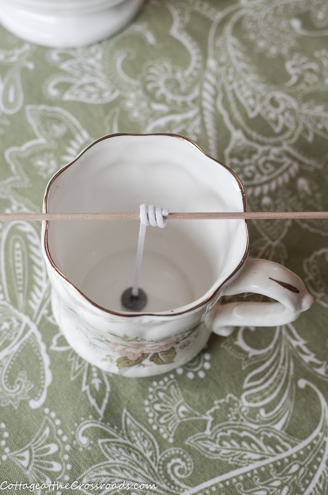 Vintage mug used in making a homemade candle