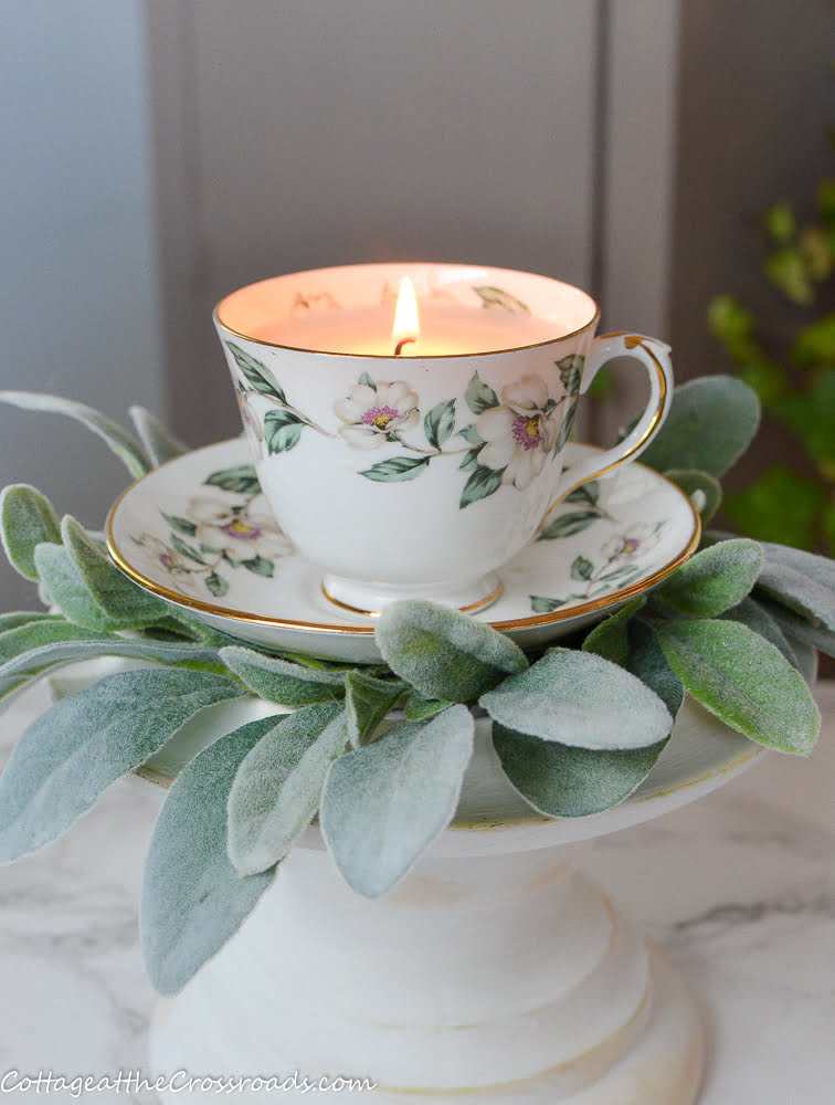 Homemade candle in a vintage tea cup