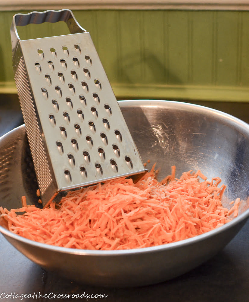 Box grater and grated sweet potatoes