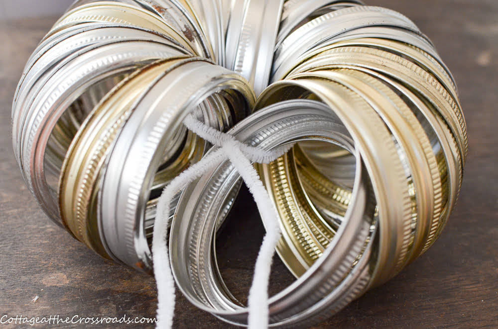 Canning rings threaded onto a pipecleaner