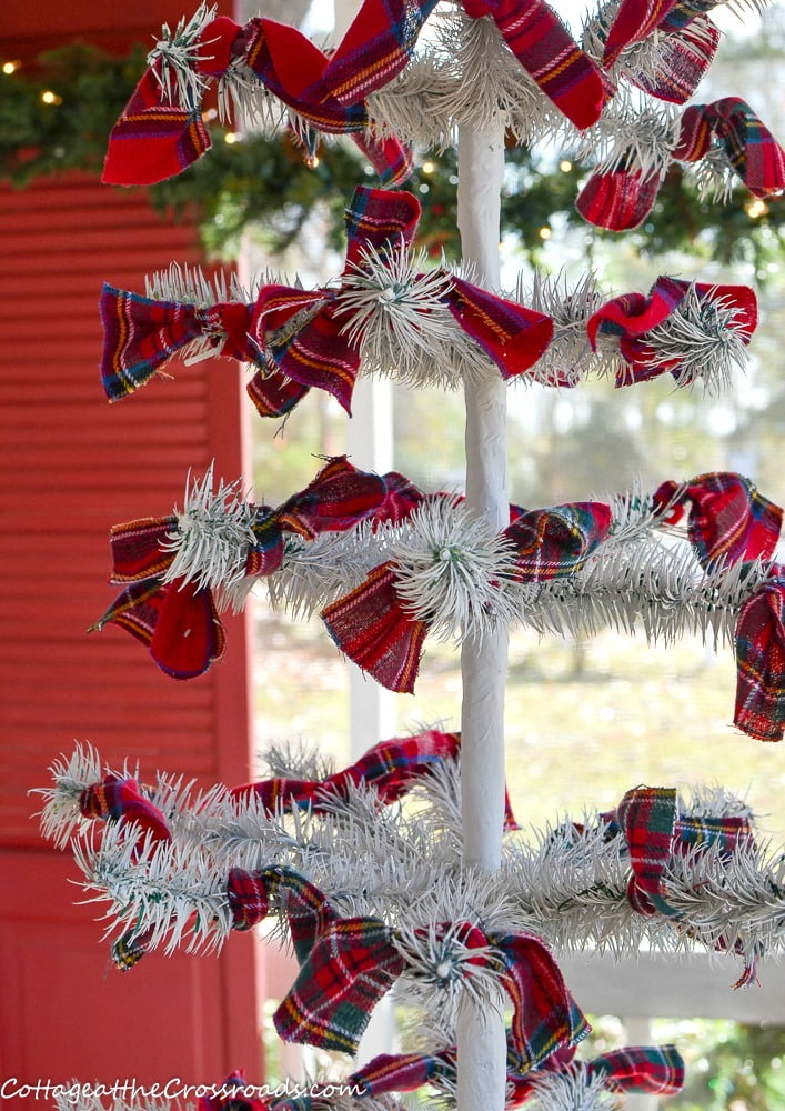 Plaid bows tied onto a reproduction feather tree