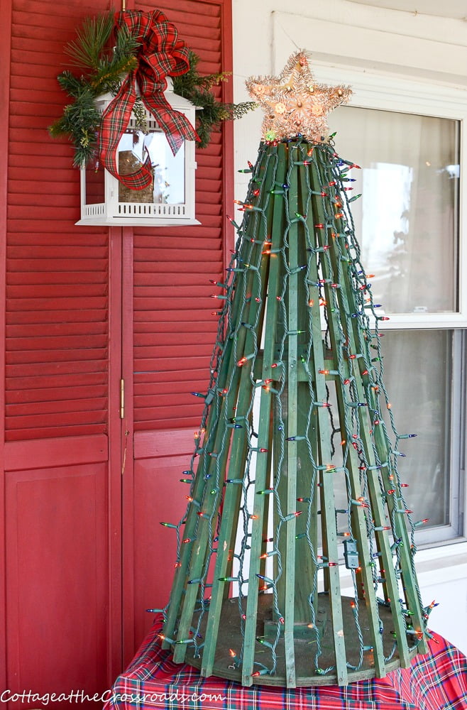 Vintage wooden christmas tree in a wheelbarrow