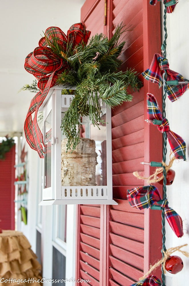 White lanterns and plaid jingle bell garlands