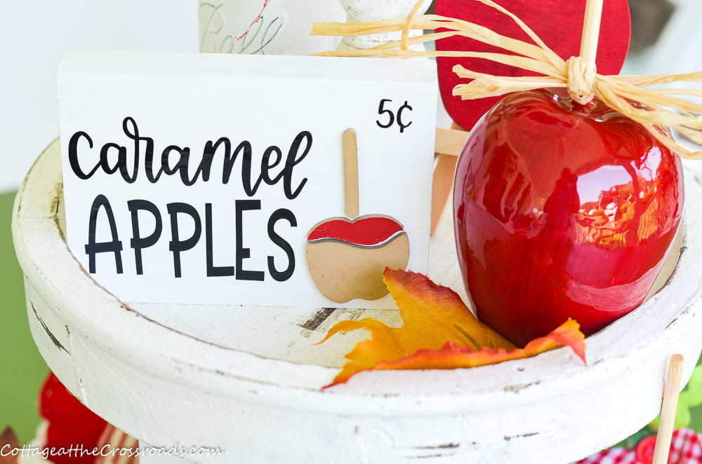 Caramel apple sign on a tiered tray