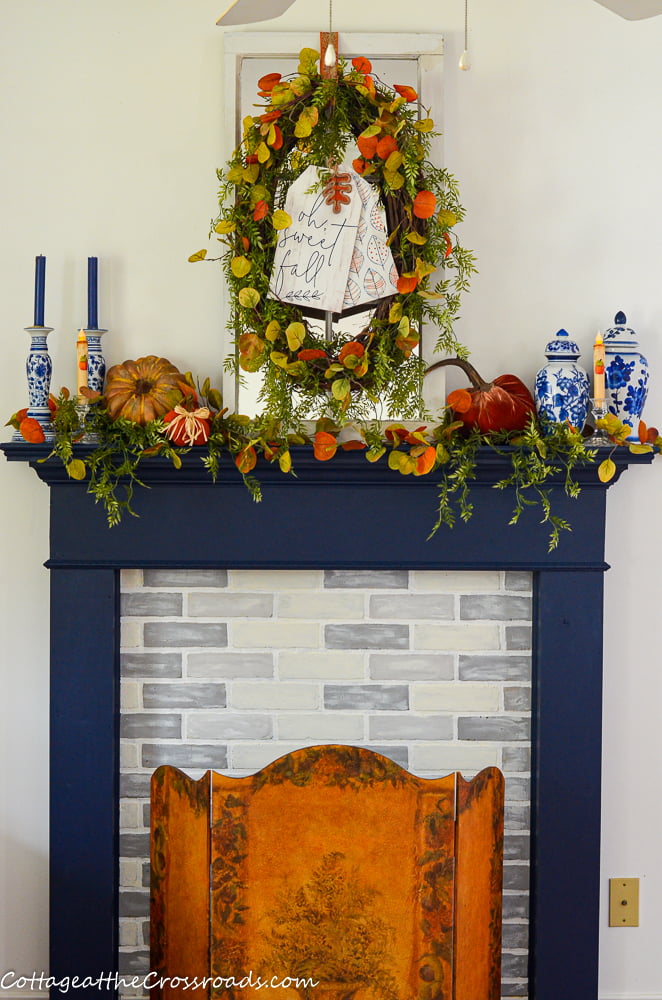 Faux fireplace decorated for fall