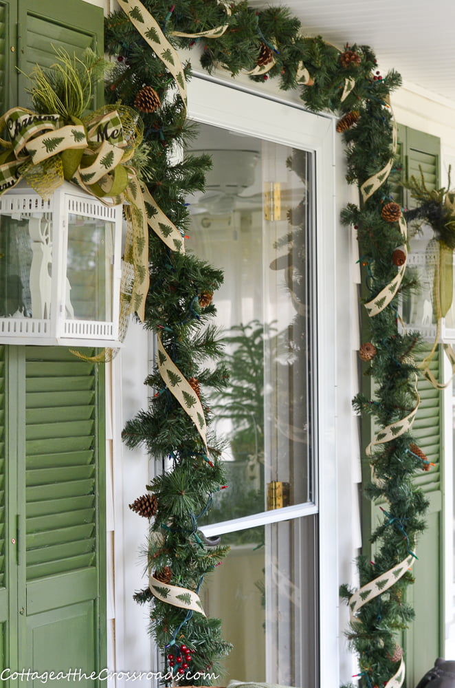 Garland and lantern on a christmas porch