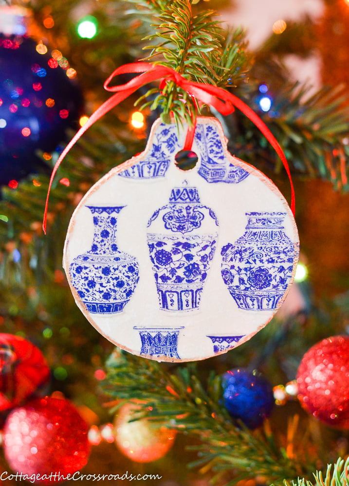 Blue and white chinoiserie christmas ornament hanging on a tree