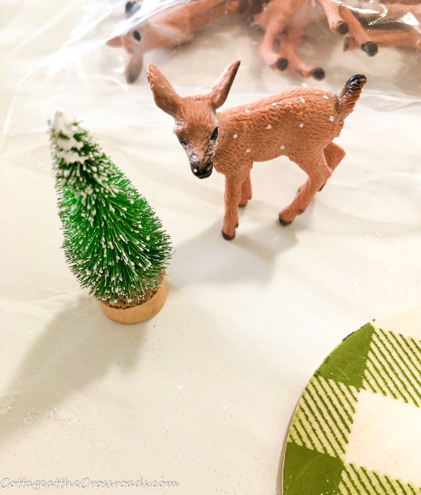 Miniature deer and tree