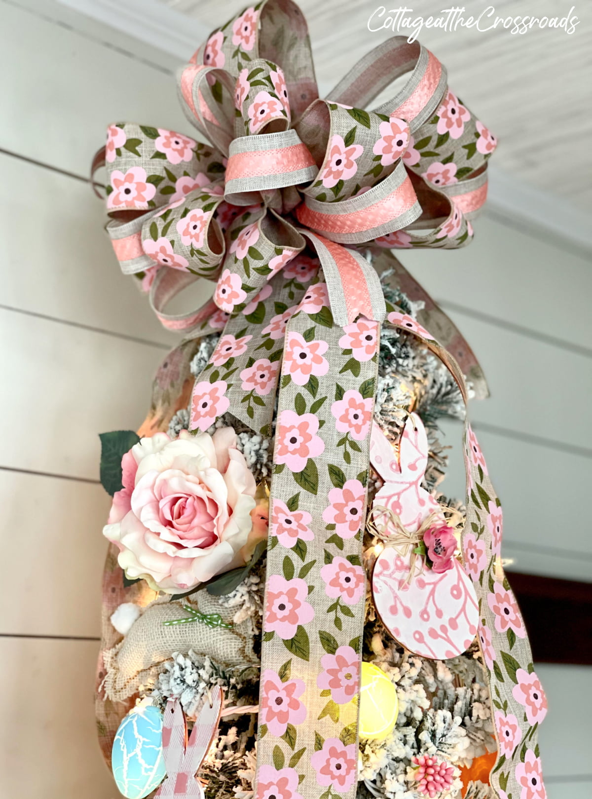 Large multi-ribbon bow on top of easter tree