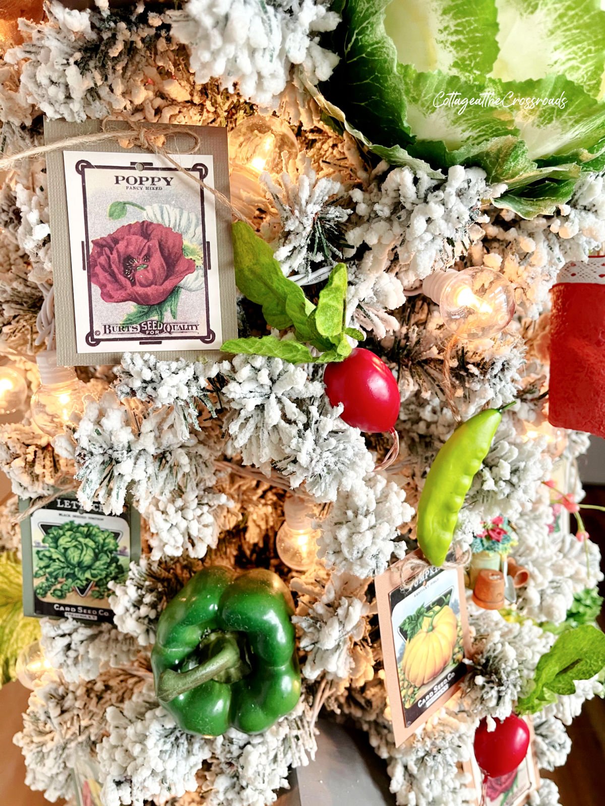 Seed packet ornaments and vegetables on a garden tree