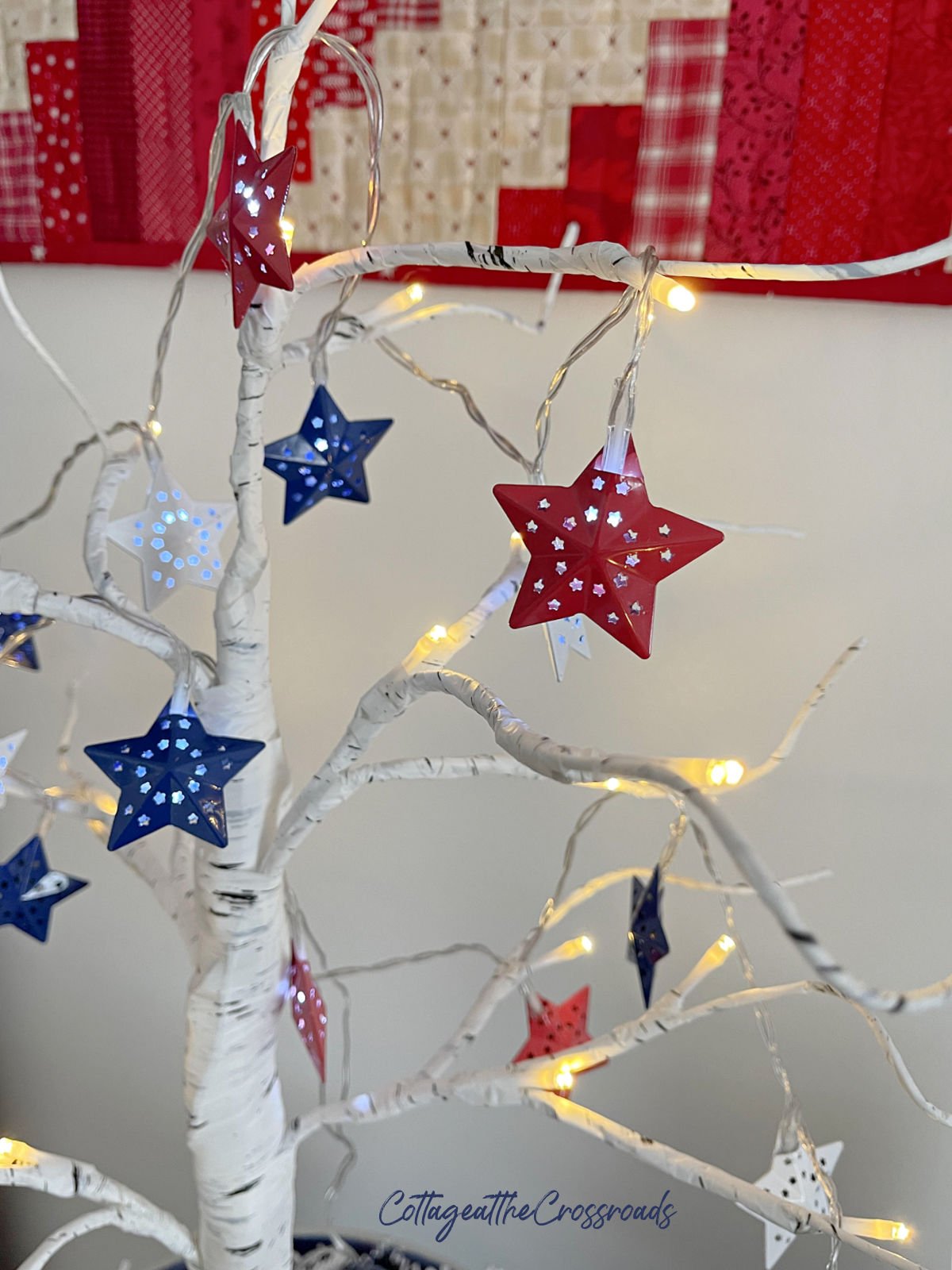 Red white and blue star lights on a tree