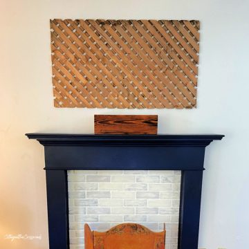 Wood lattice wall panel above a mantel