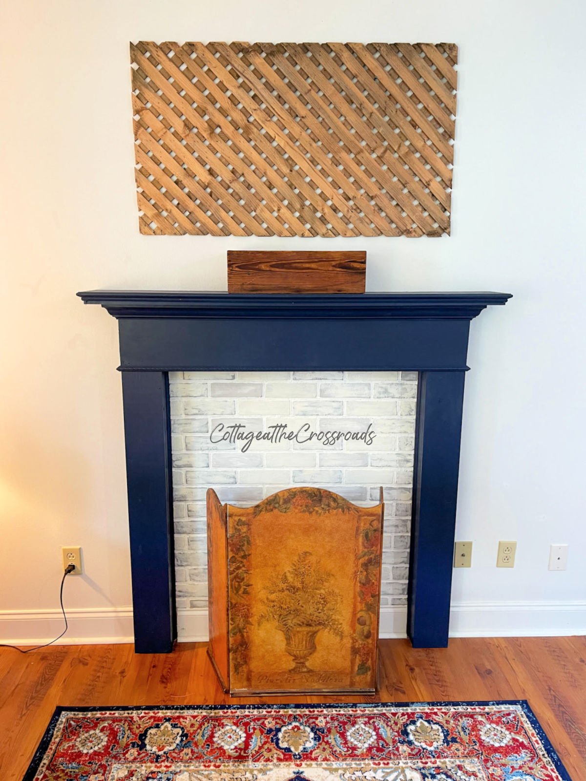 Wood lattice panel hanging on the wall over a navy mantel