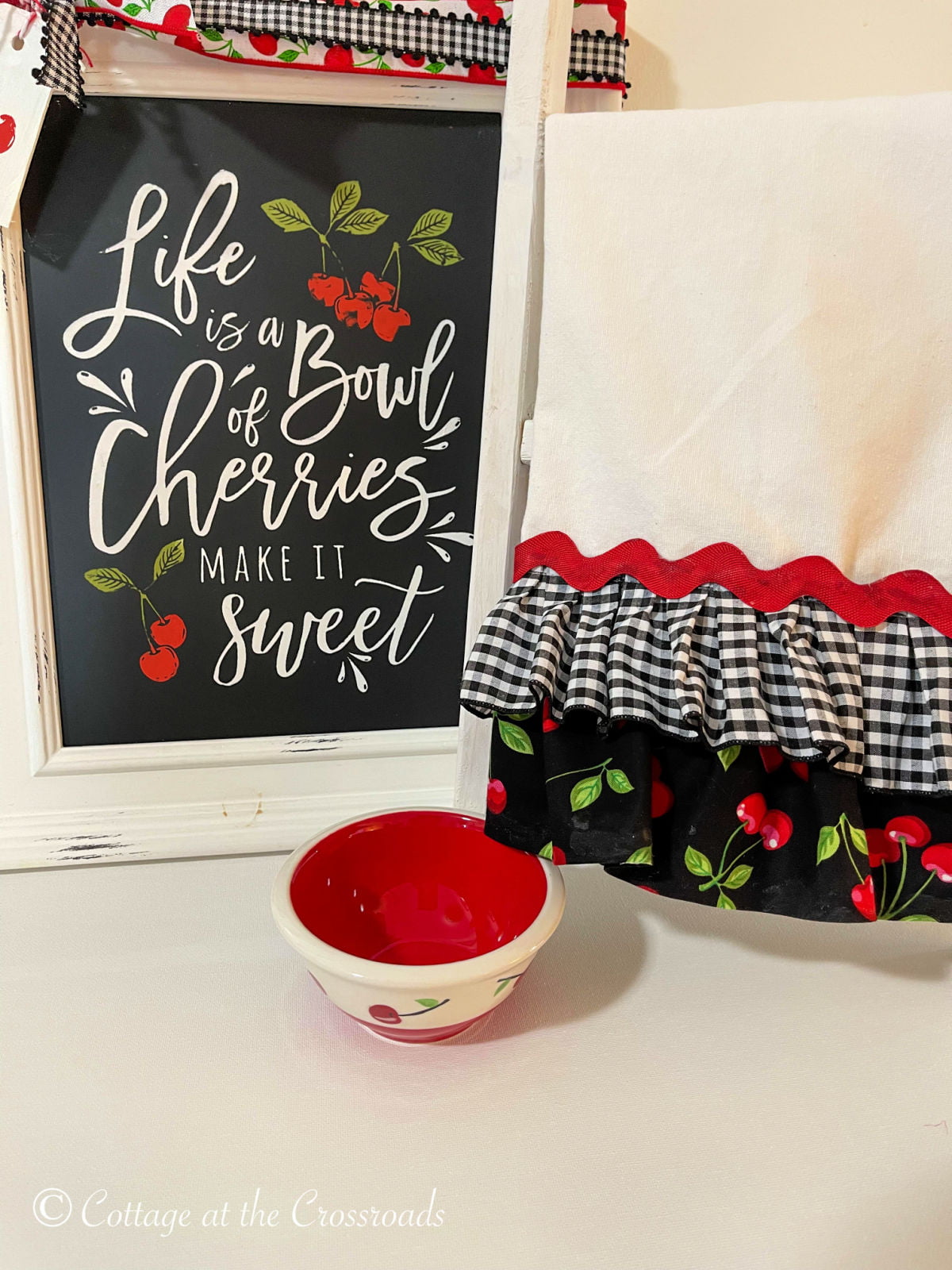 https://cottageatthecrossroads.com/wp-content/uploads/2021/07/ruffled-tea-towel-cherry-bowl-and-sign-1.jpg