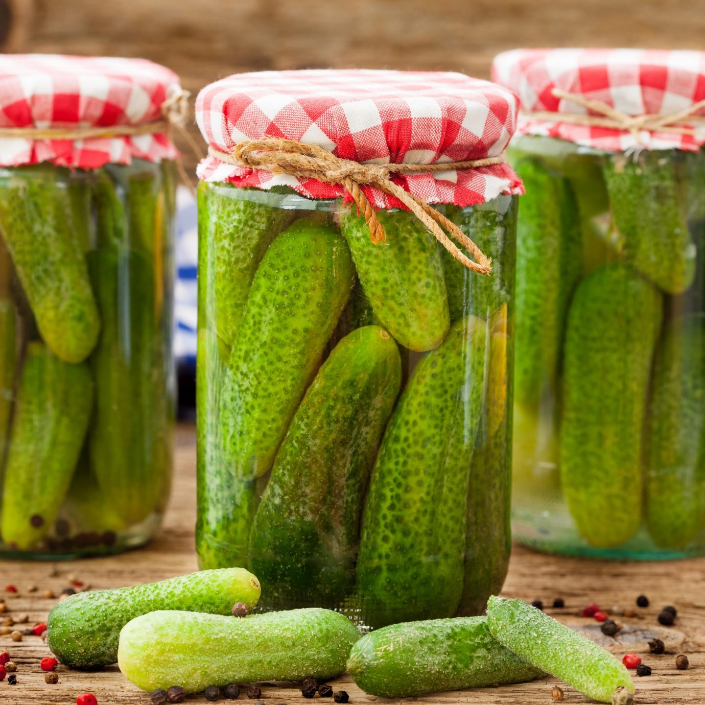New canning jars with fresh garden cucumbers