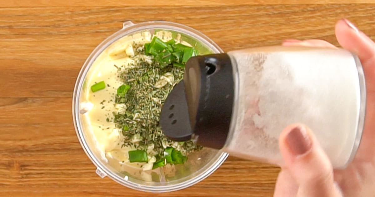 Ingredients being added to a blender to make cucumber ranch dressing