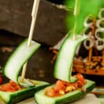 Cucumber salad boats on a charcuterie board