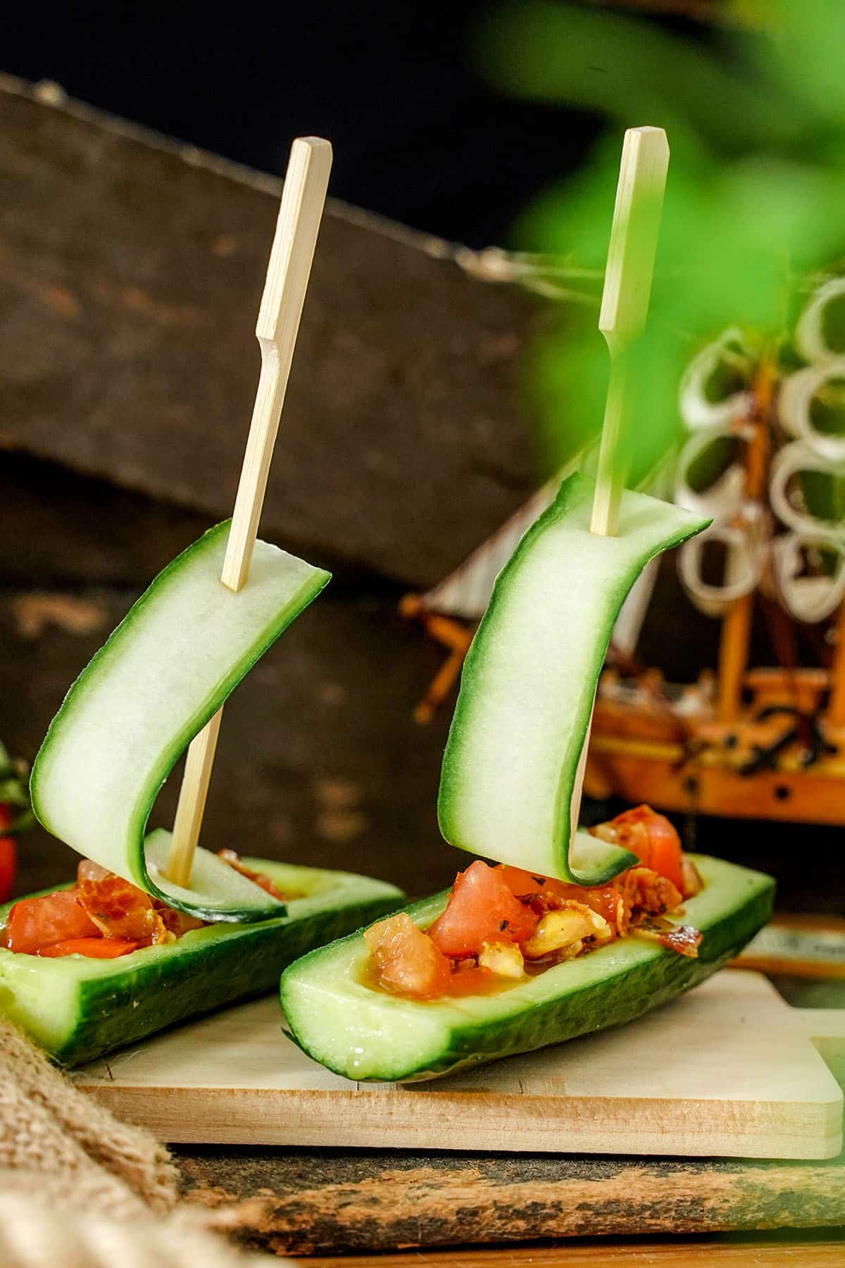 Cucumber salad boats on a charcuterie board