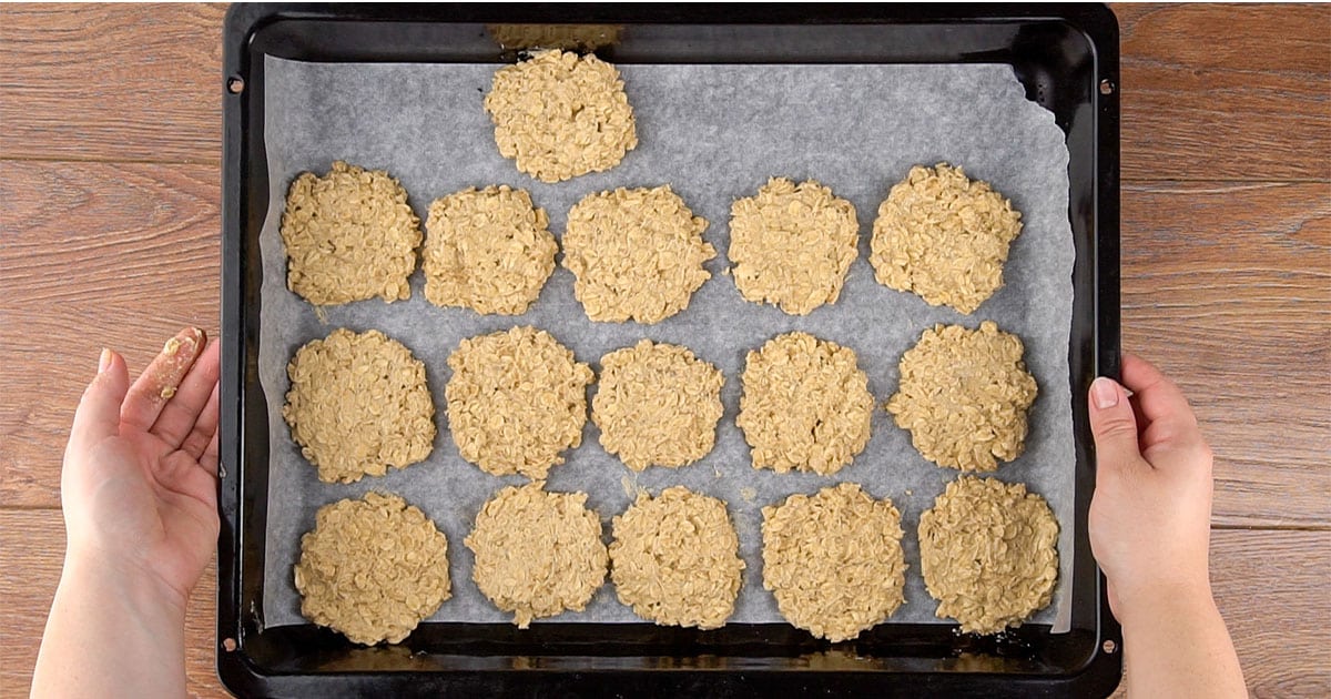 Oatmeal cream pie cookies on a baking sheet to be baked