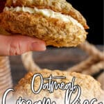 Hand holding an old fashioned oatmeal sandwich cookie with text which reads oatmeal cream pies