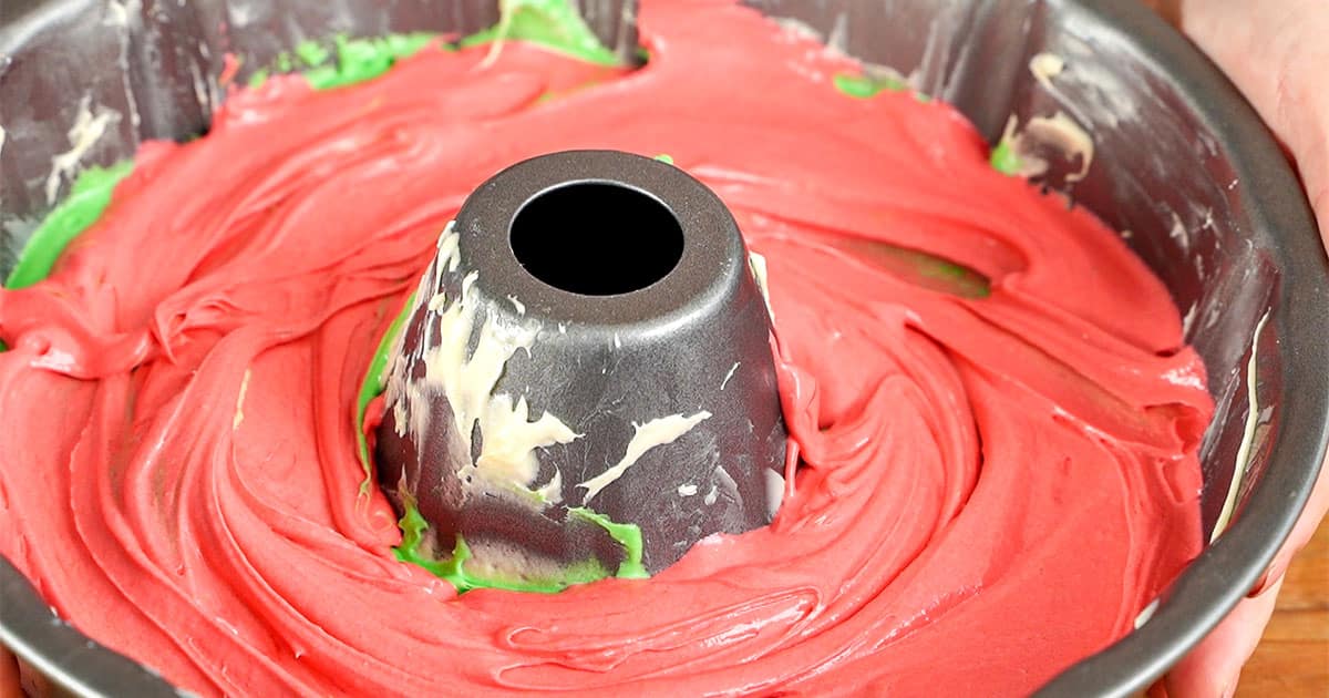 Closeup of batter layered in a bundt cake pan to make old fashioned ribbon cake