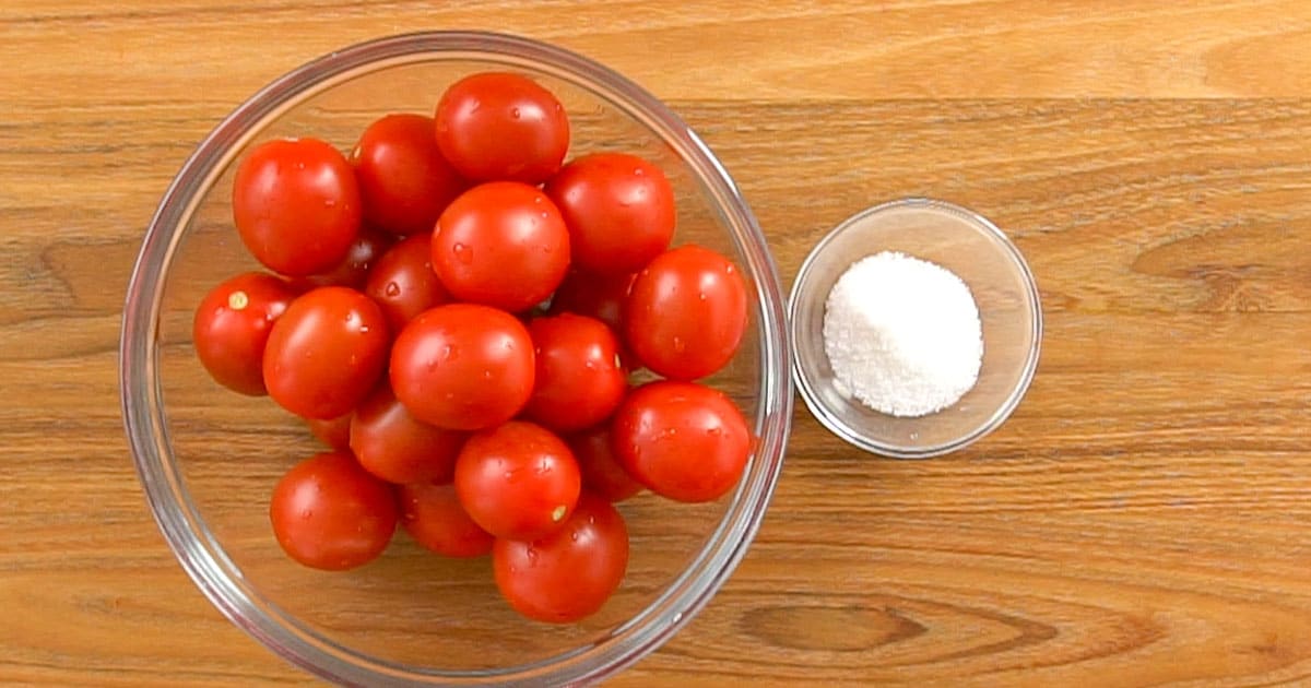 Overhead view of ingredients necessary to make homemade canned tomatoes