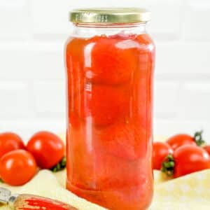Closeup of jar of canned tomatoes