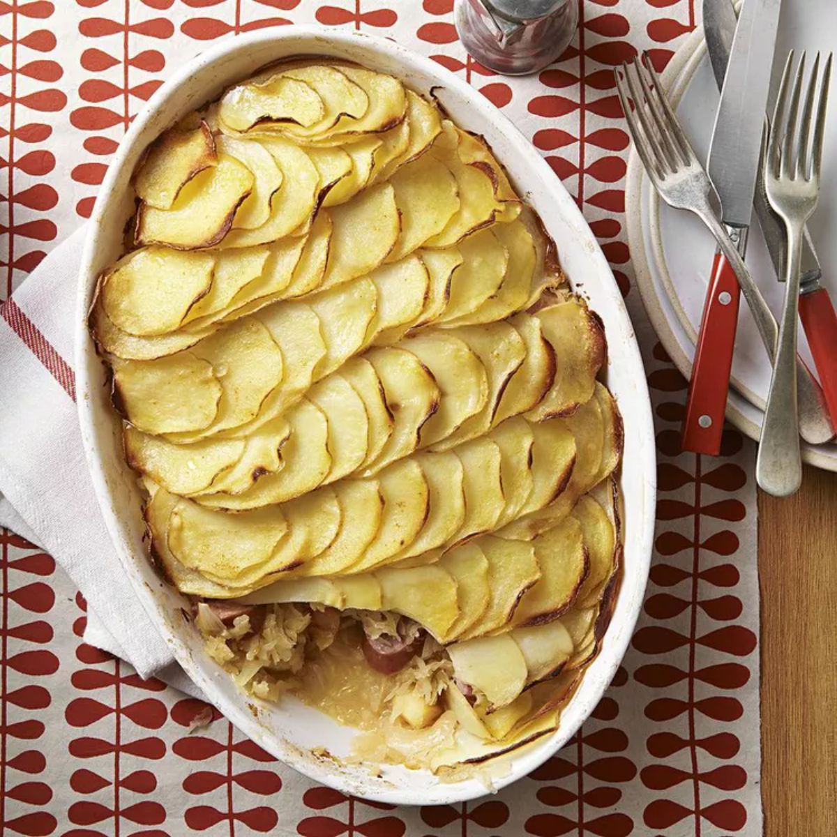 Sauerkraut & sausage in a white casserole.