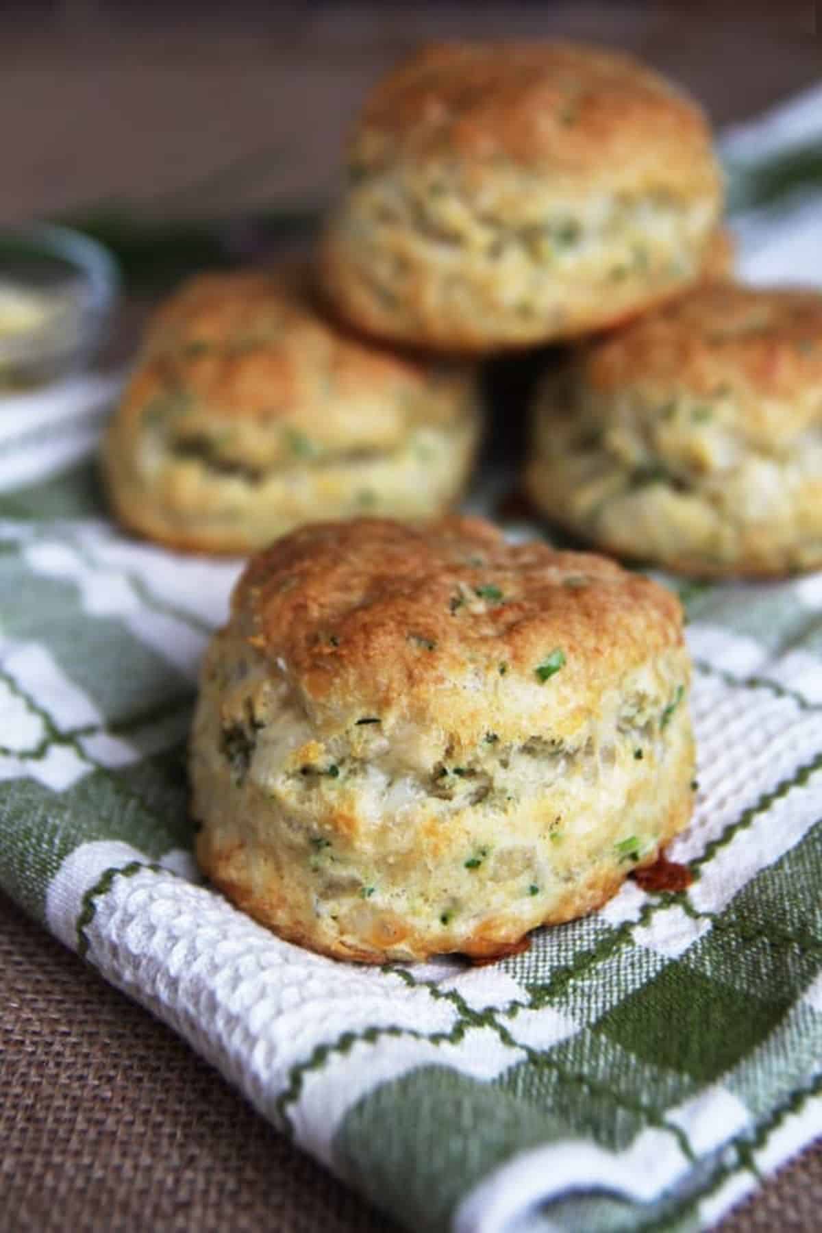 Cheese and chive sourdough biscuits on a piece of cloth.