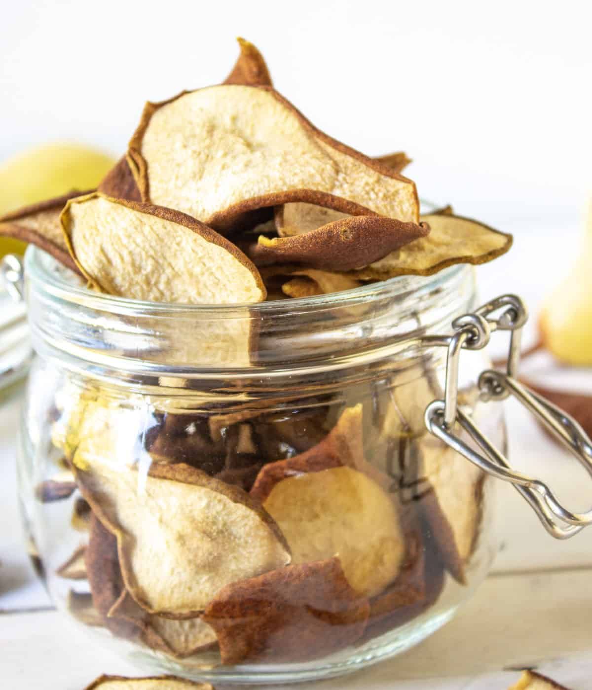 Pear chips in a glass jar.