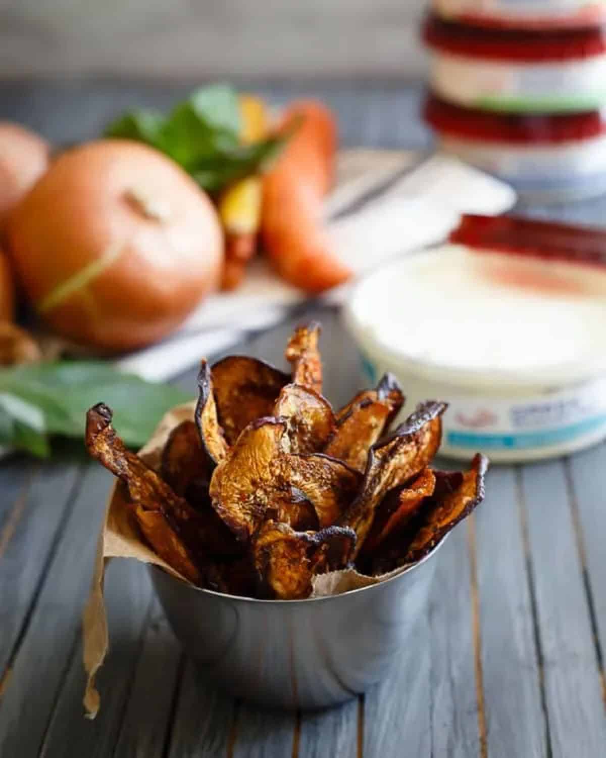Mediterranean eggplant chips in a small metal bowl.