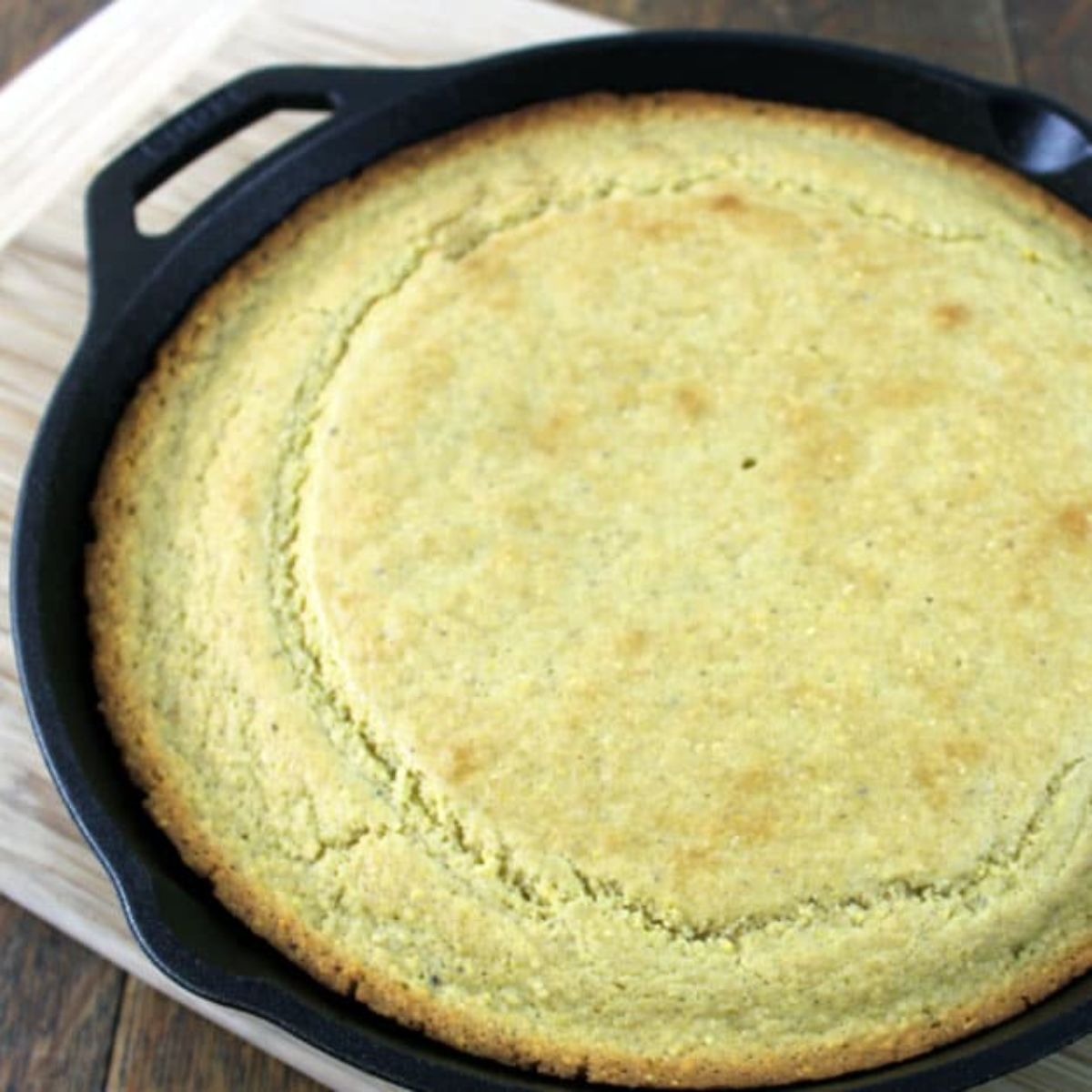 Sourdough cornbread in a black skillet.