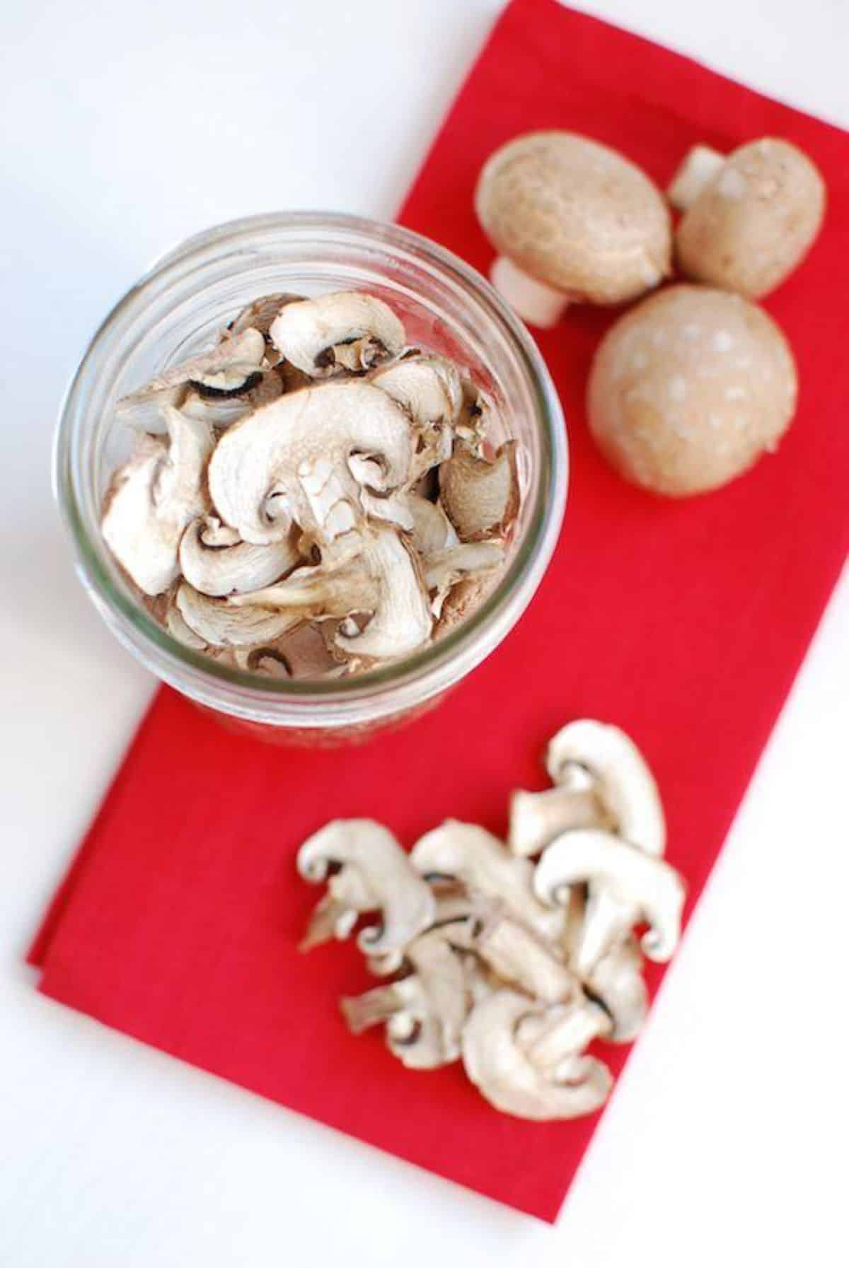 A glass jar of dehydrated mushrooms.