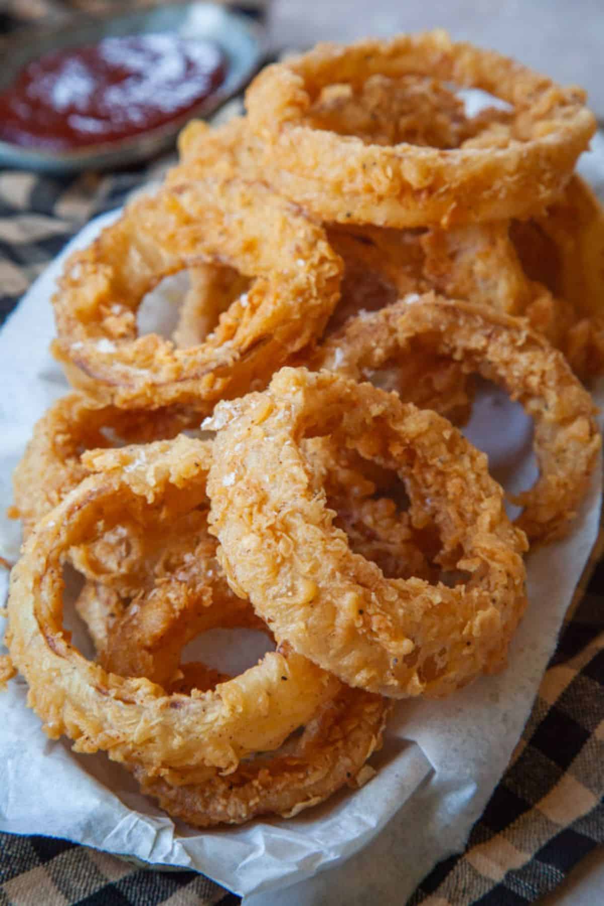 Sourdough onion rings on a paper napkin.