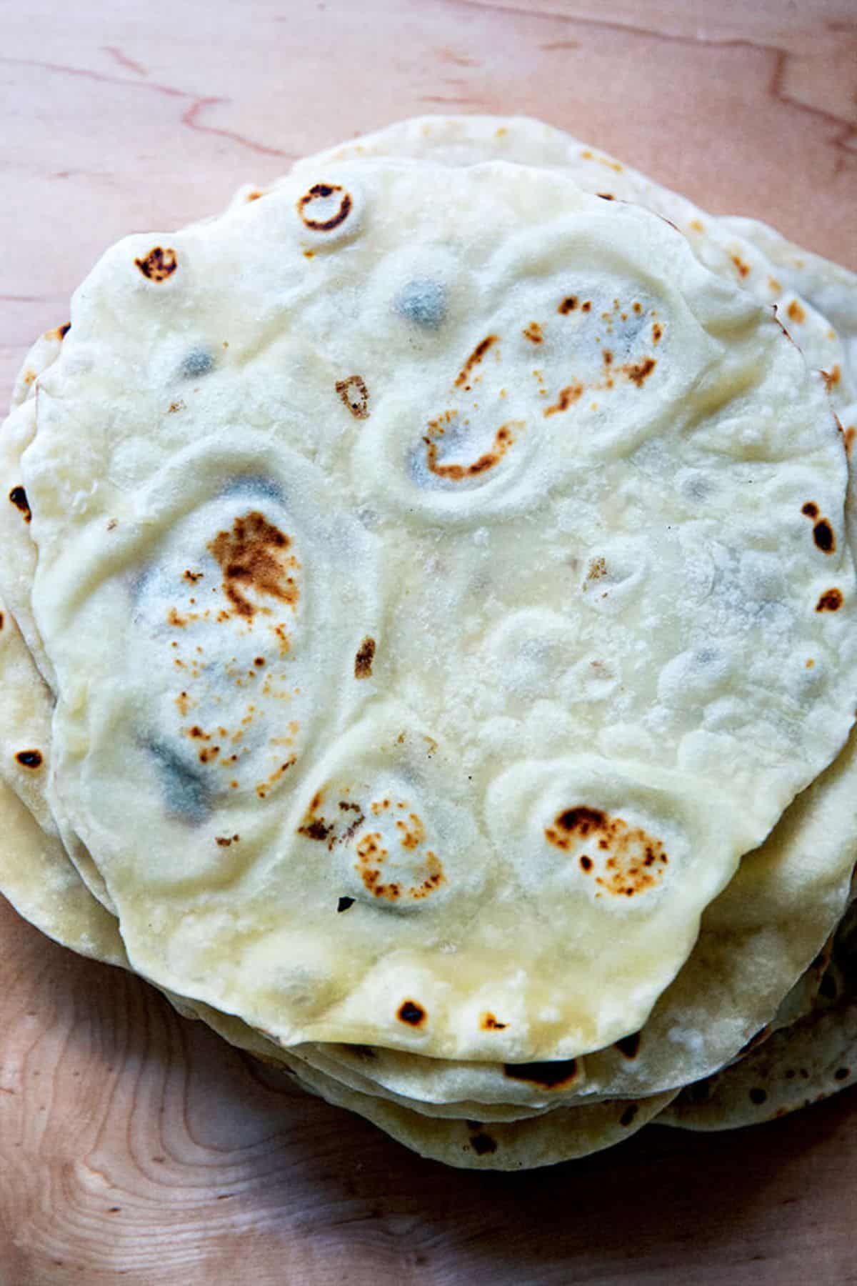 A pile of sourdough flour tortillas.