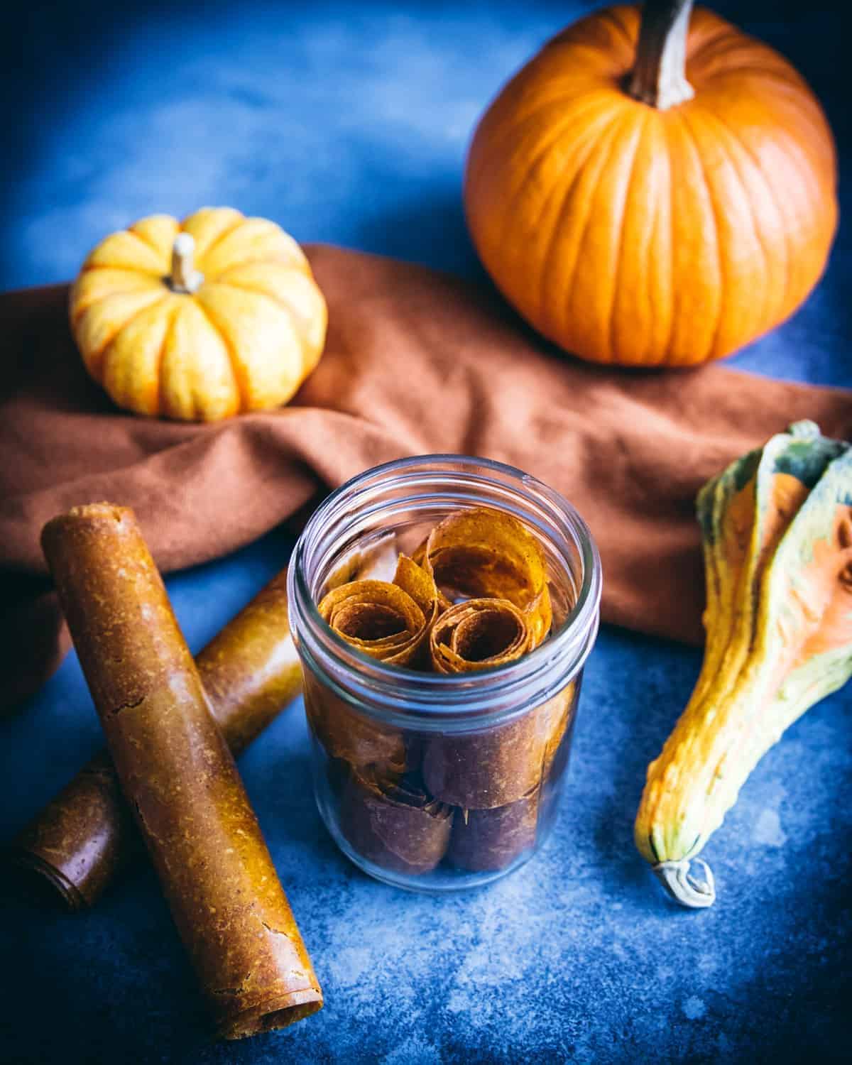 Pumpkin pie leather roll-ups in a glass jar.