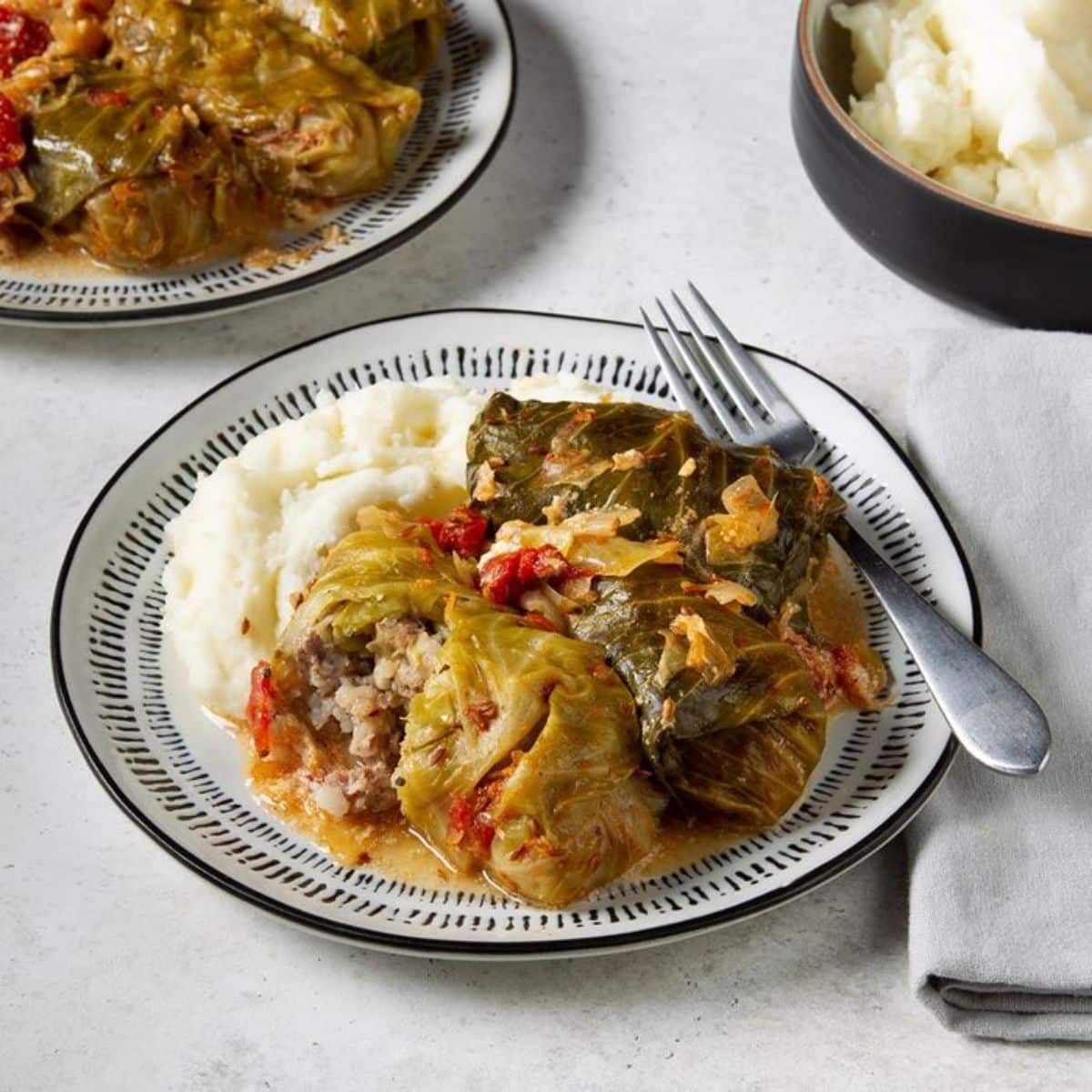 Hungarian stuffed cabbage on a plate with a fork.